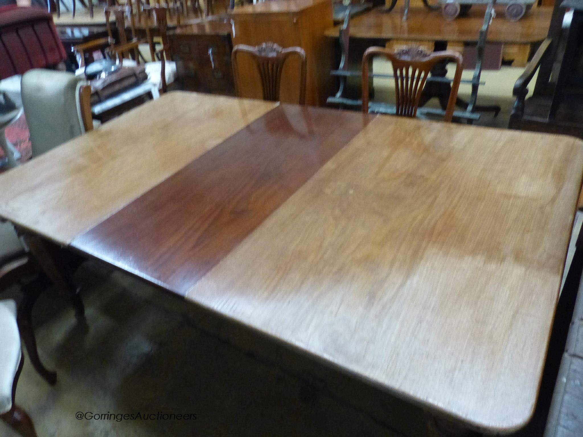 A mid Victorian mahogany extending dining table, 184cm extended with one spare leaf, width 109cm, height 71cm